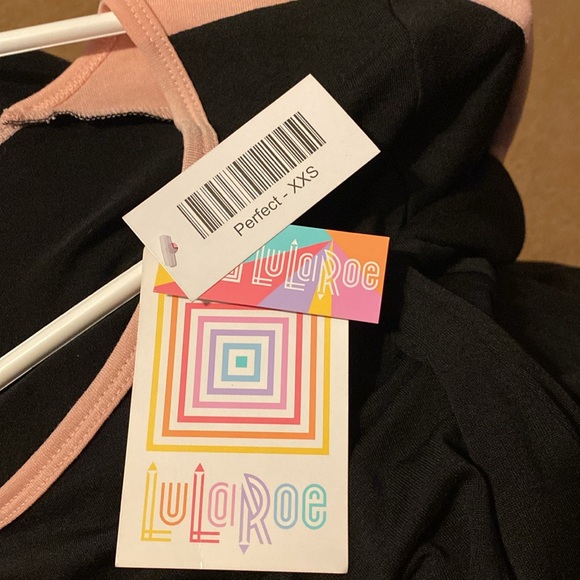 NWT LULaRoe black with pink on top of sleeves. Size xs. 95 polyester 5 spandex - Picture 8 of 8